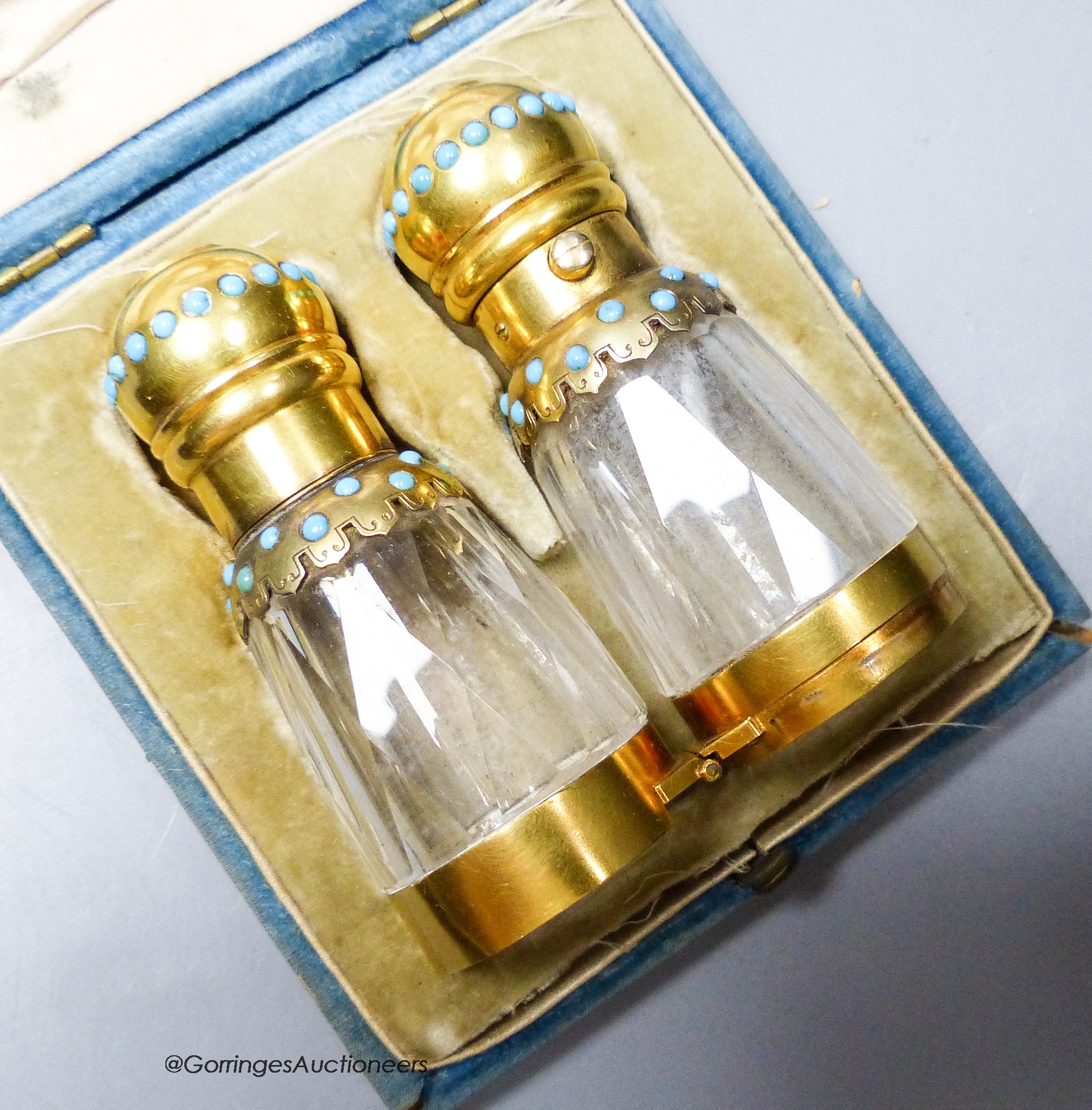 A Victorian cased gilt white metal and turquoise bead mounted facetted glass double ended folding scent bottle, 14cm.